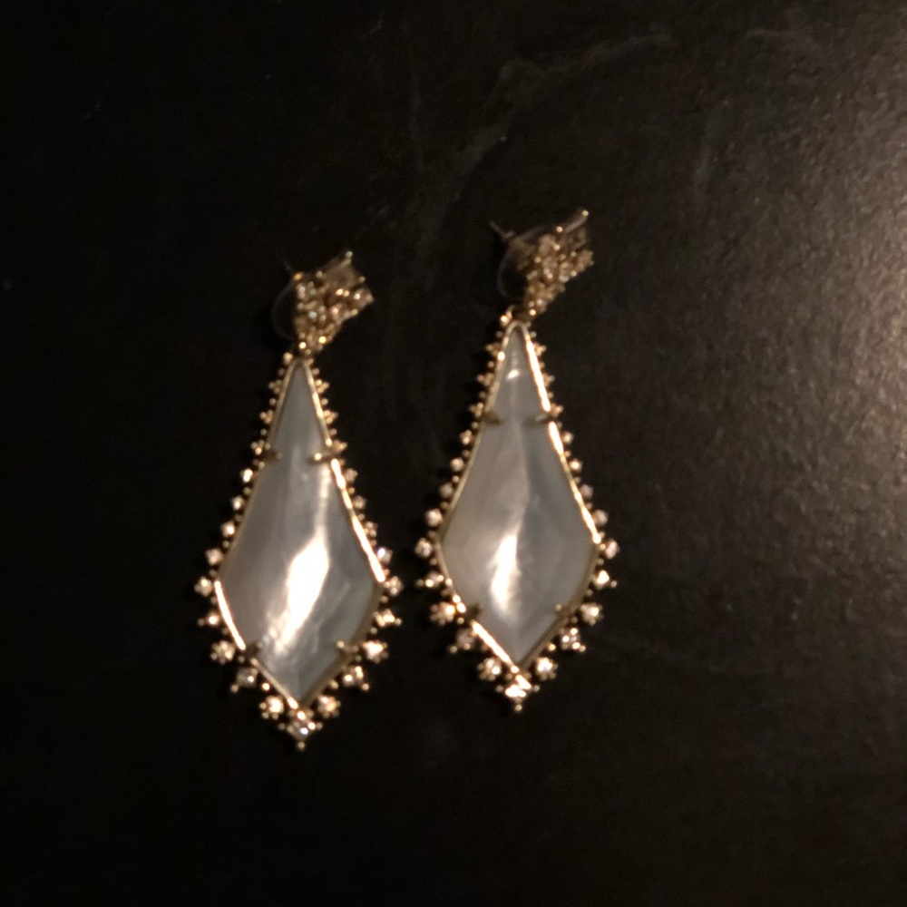 Kendra Scott earrings in white and gold